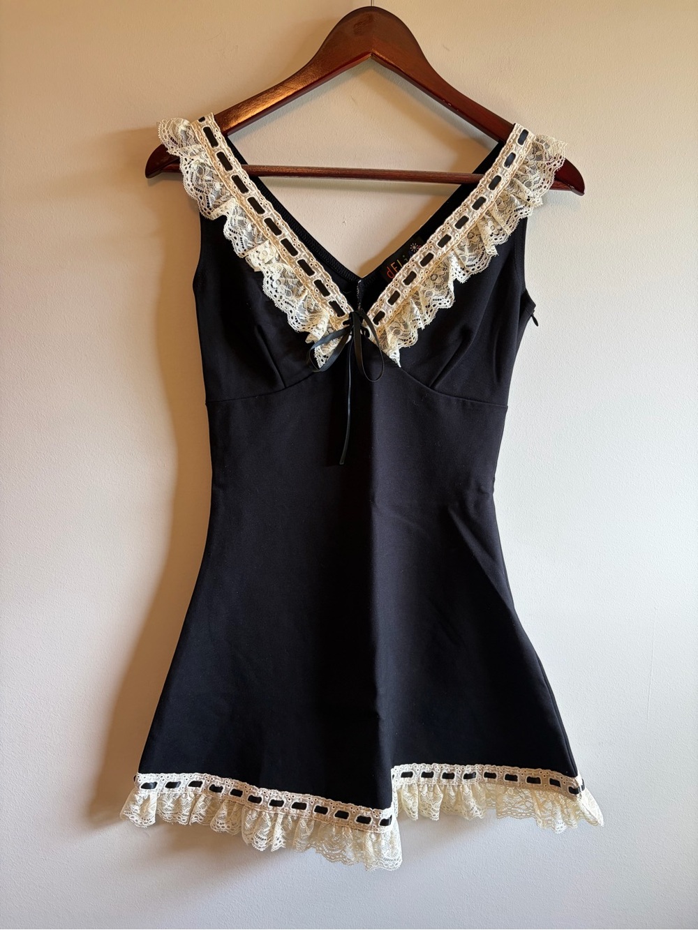 Doll’s Kill and Delia’s Black Lace-Trim Dress